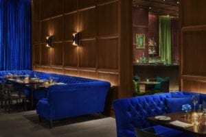 Blue velvet banquet seating in low light