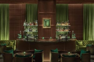 Hotel Bar with green accents and ample seating
