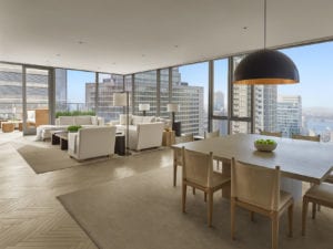 Penthouse open living area with sprawling city view