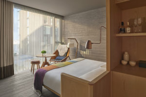 guest room with floor to ceiling window