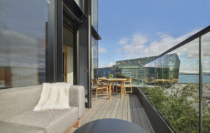 Balcony with dining table and sofa