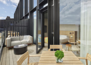 Balcony with dining table and sofa