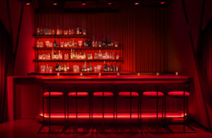 All red bar lined with stools