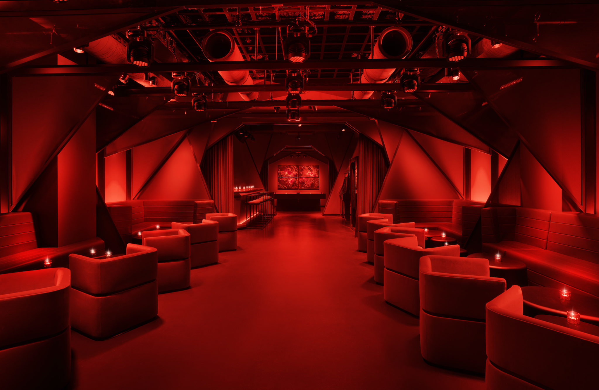 Lounge with intimate seating and red lighting