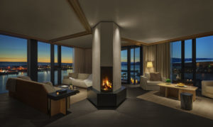 Penthouse living room with expansive view and column fireplace