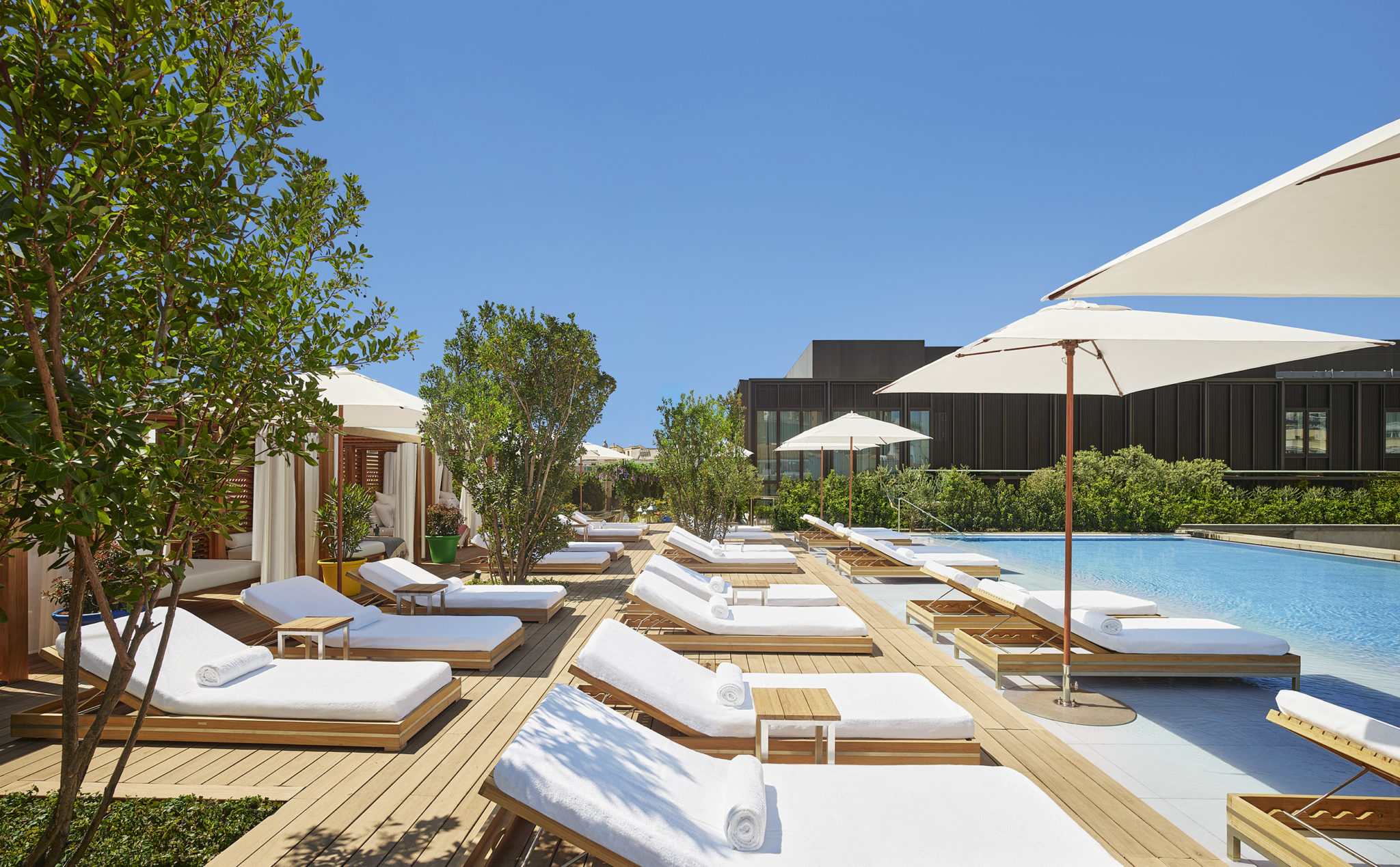 Sun loungers and umbrellas poolside