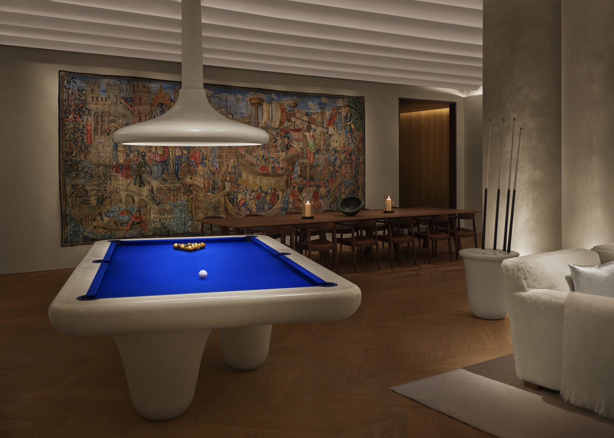 Modern pool table with communal table in background