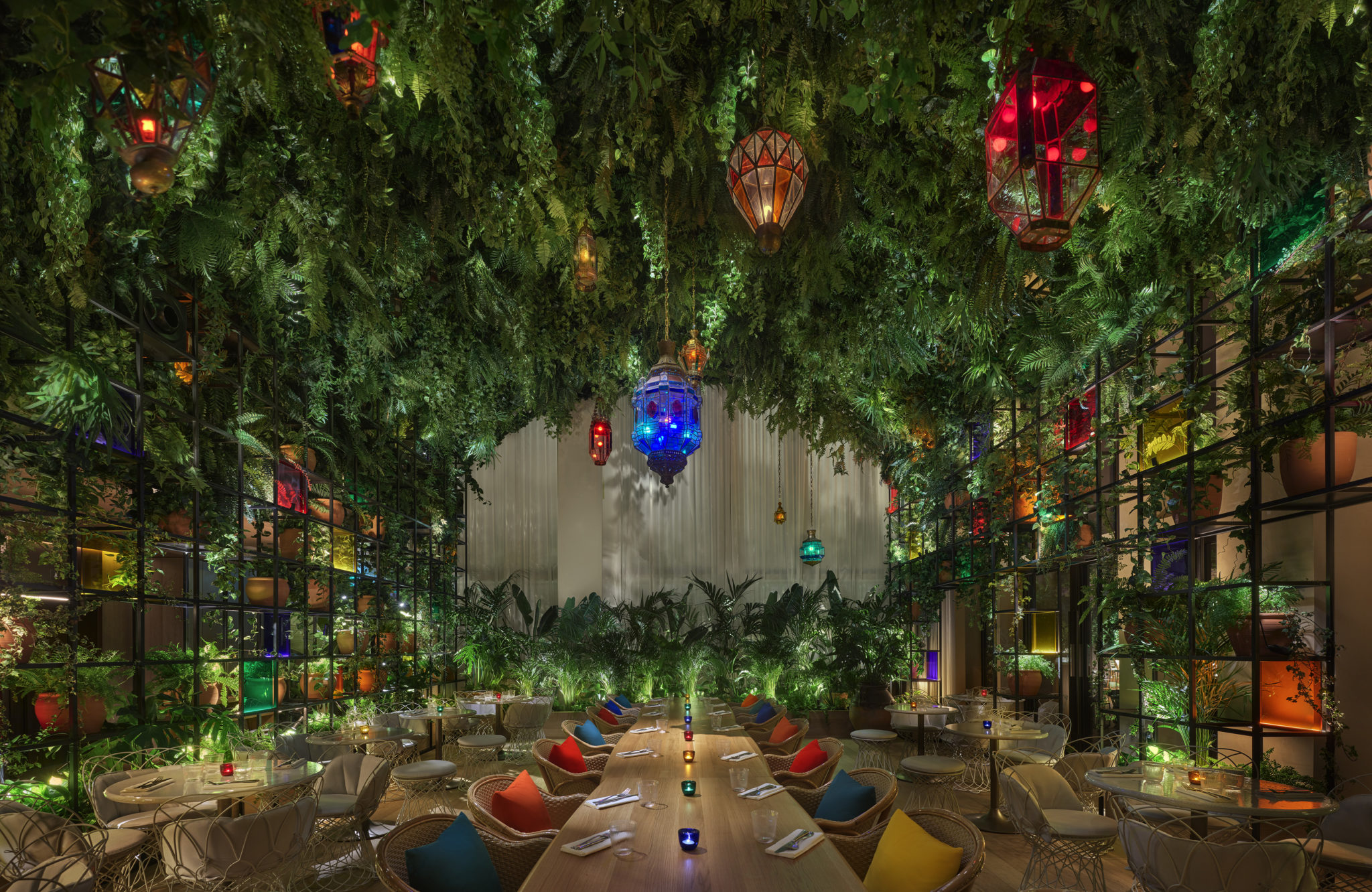 Dining area with hanging garden and colorful lanterns