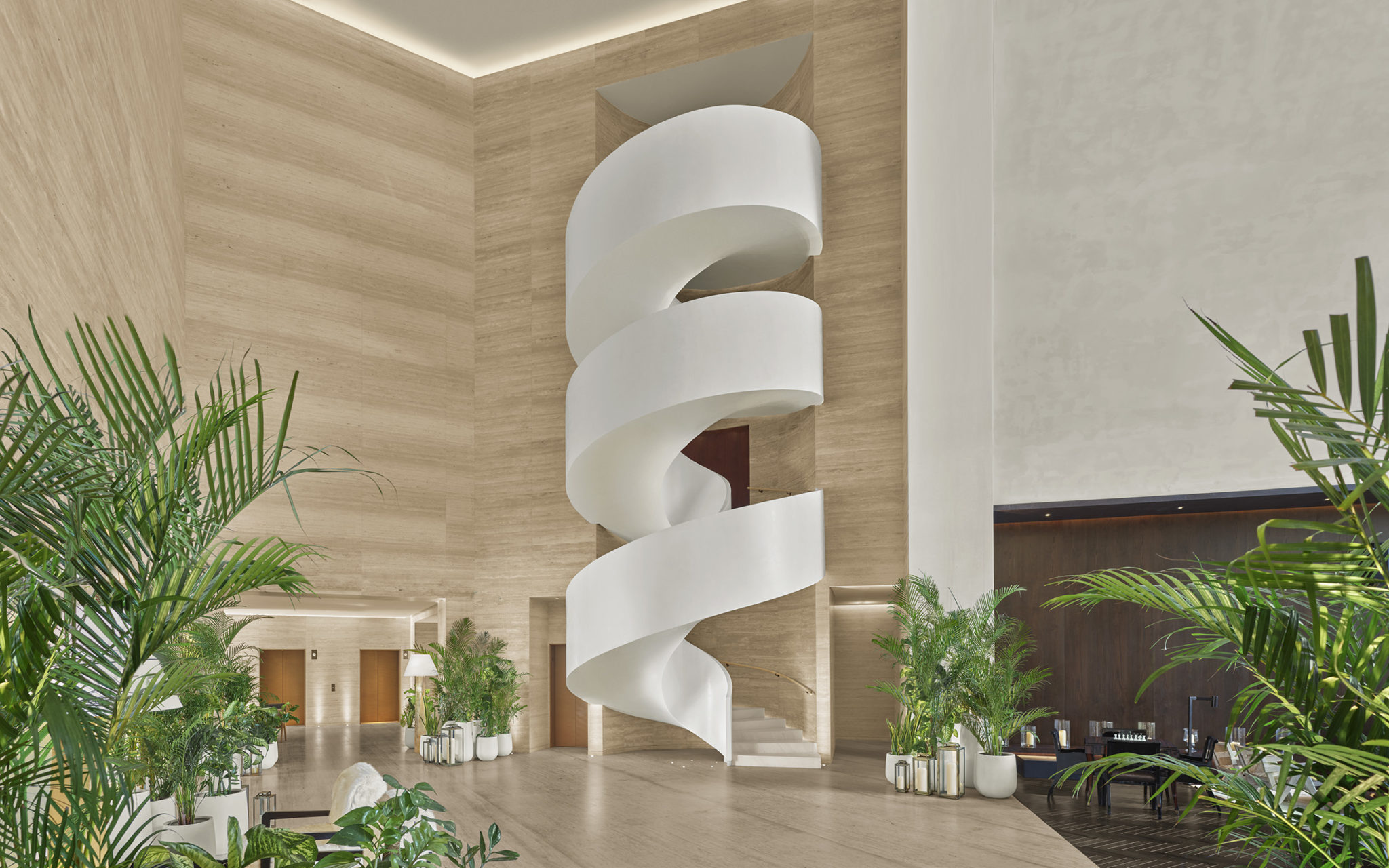 Large white spiral staircase in lobby