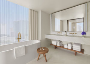 White marble bathroom with deep bathtub