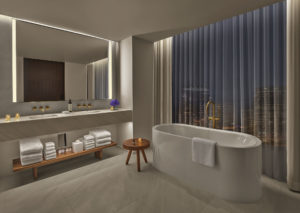 White marble bathroom with deep bathtub