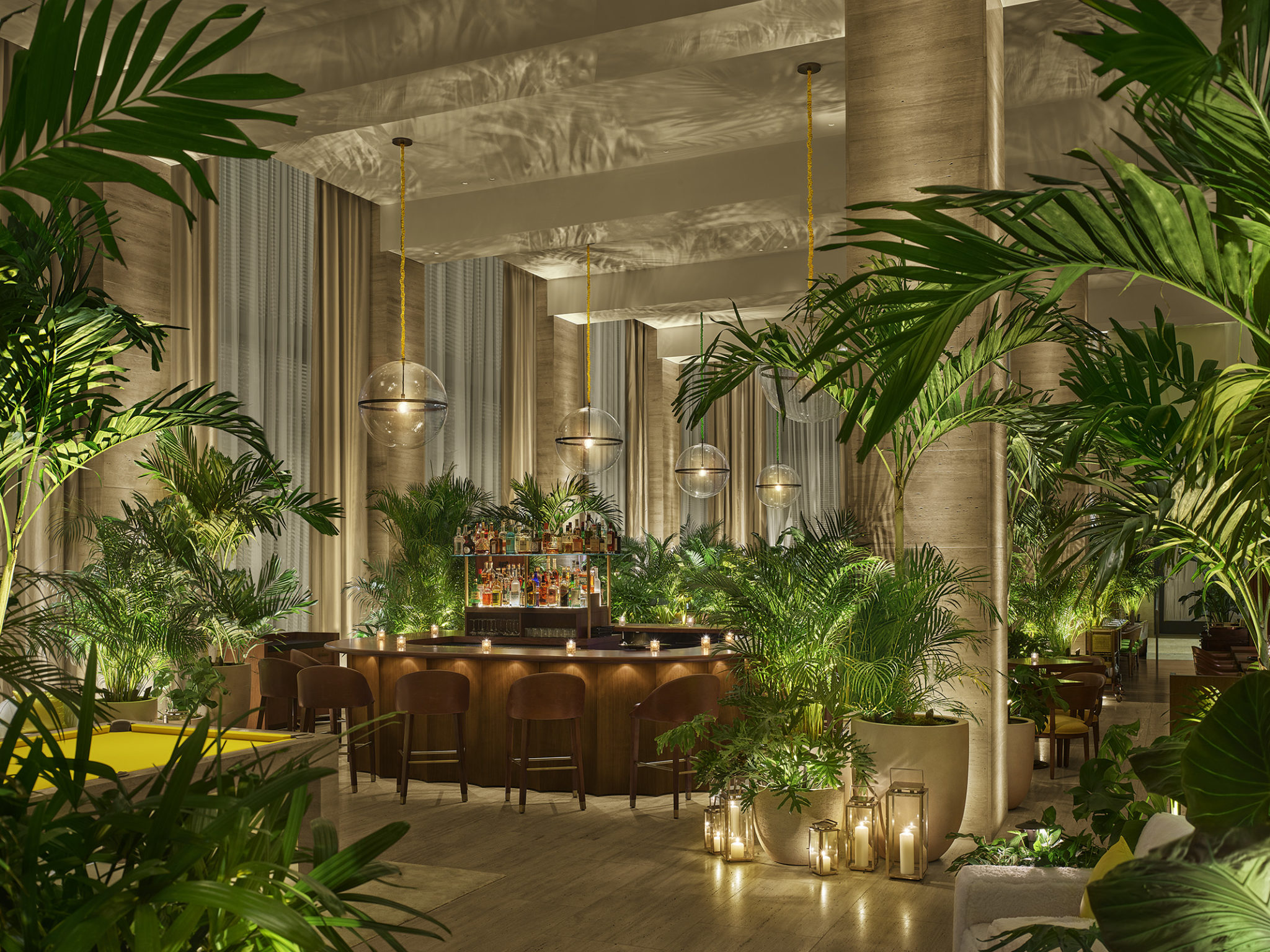 Lobby bar area lit with candles and spherical globe lighting