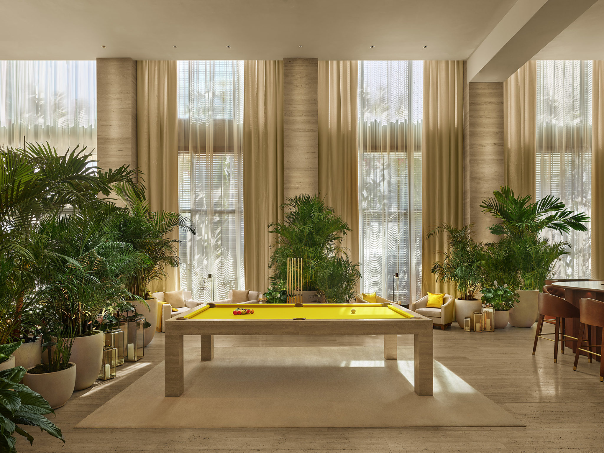 Pool table in tropically decorated lobby