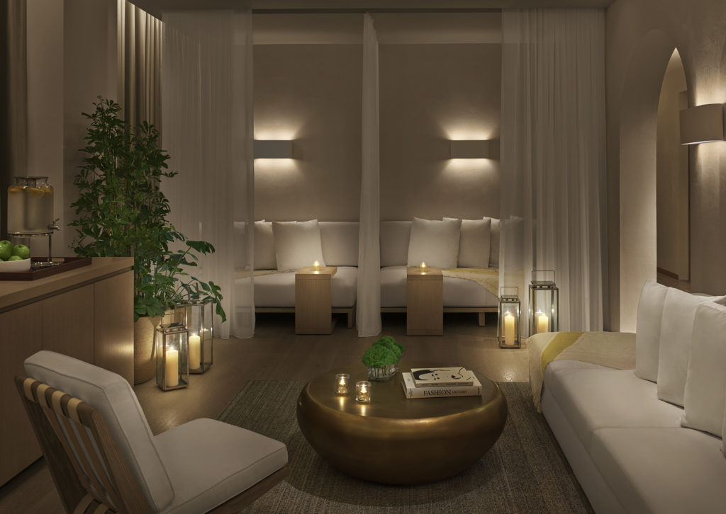Lounge del spa iluminado con velas