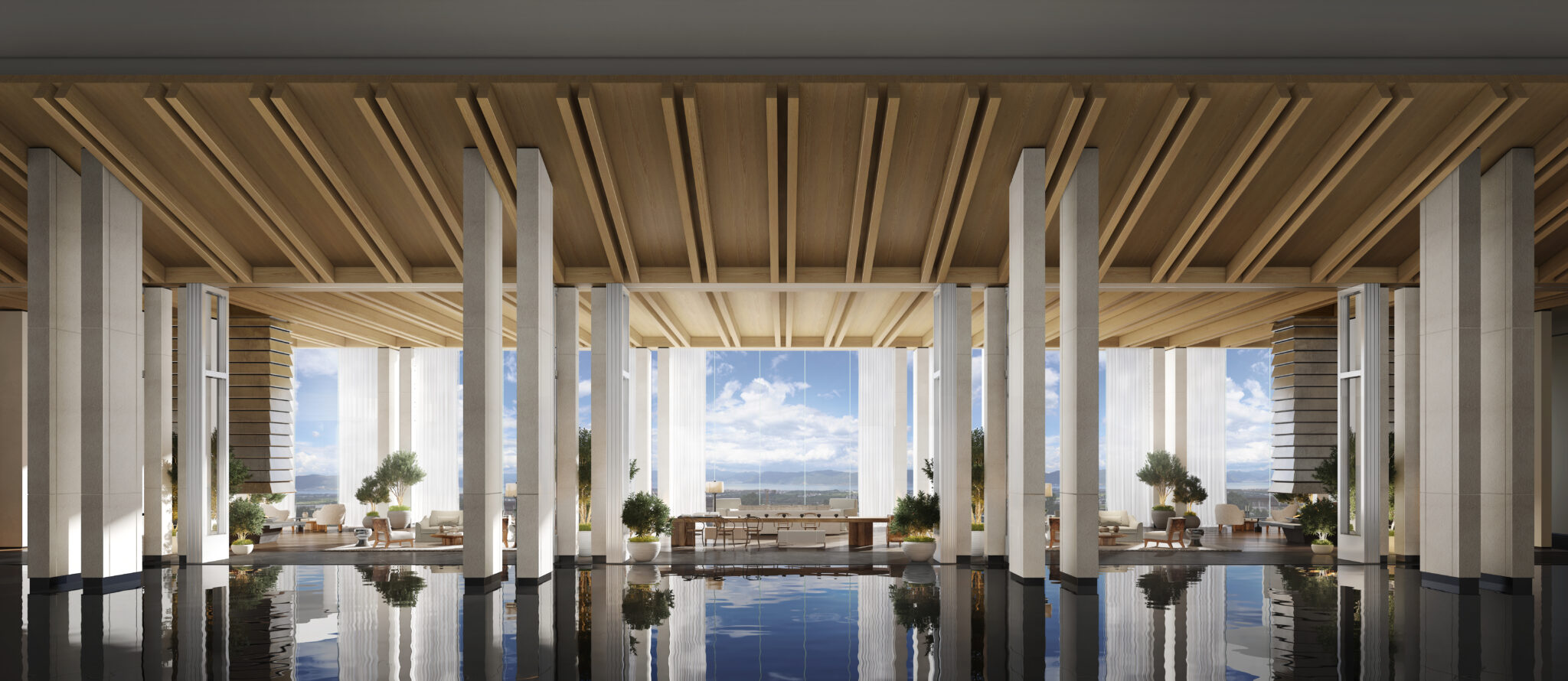 View from lobby with large windows, blue skies and clouds