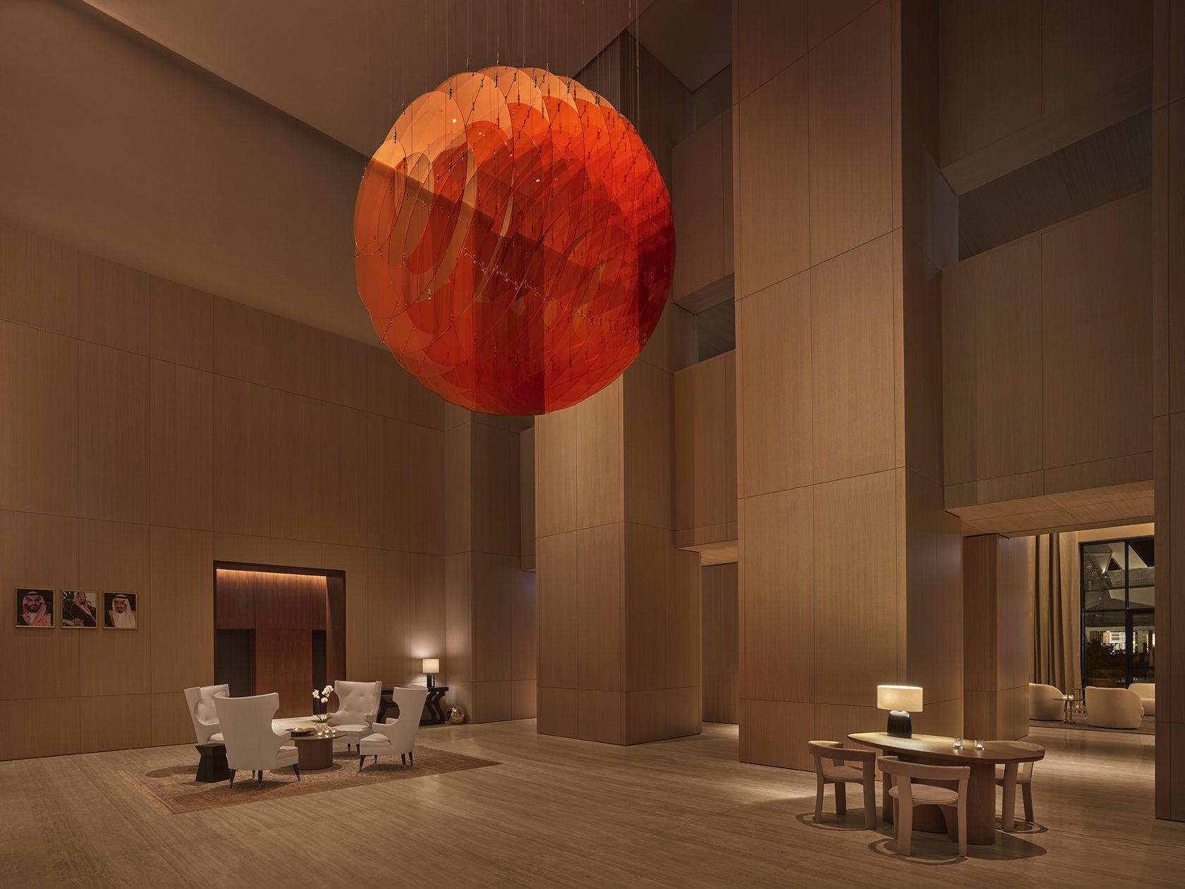 Image of hotel lobby with large orange statement light fixture