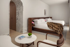 Guest room with seating area and two queen beds