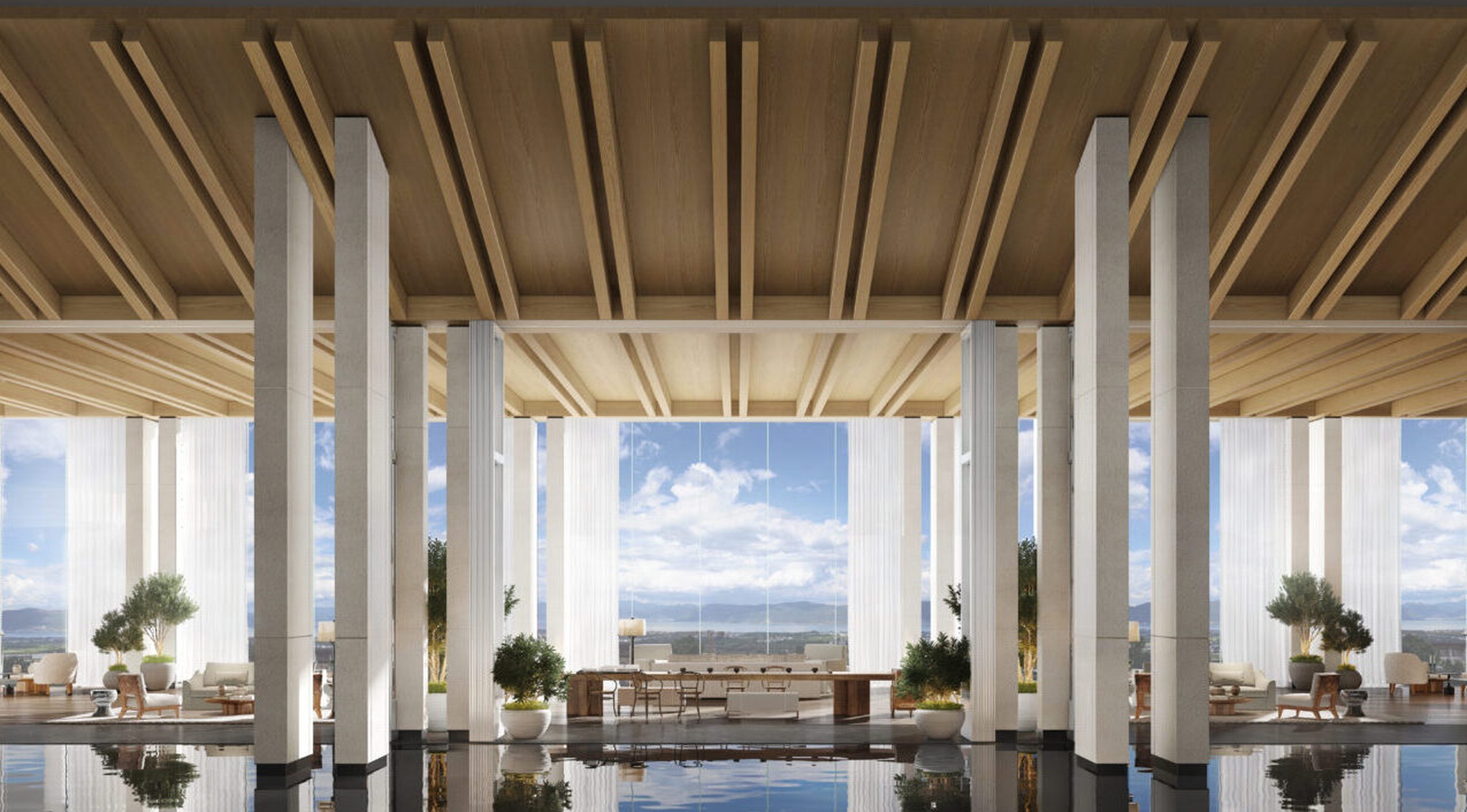 View from lobby with large windows, blue skies and clouds